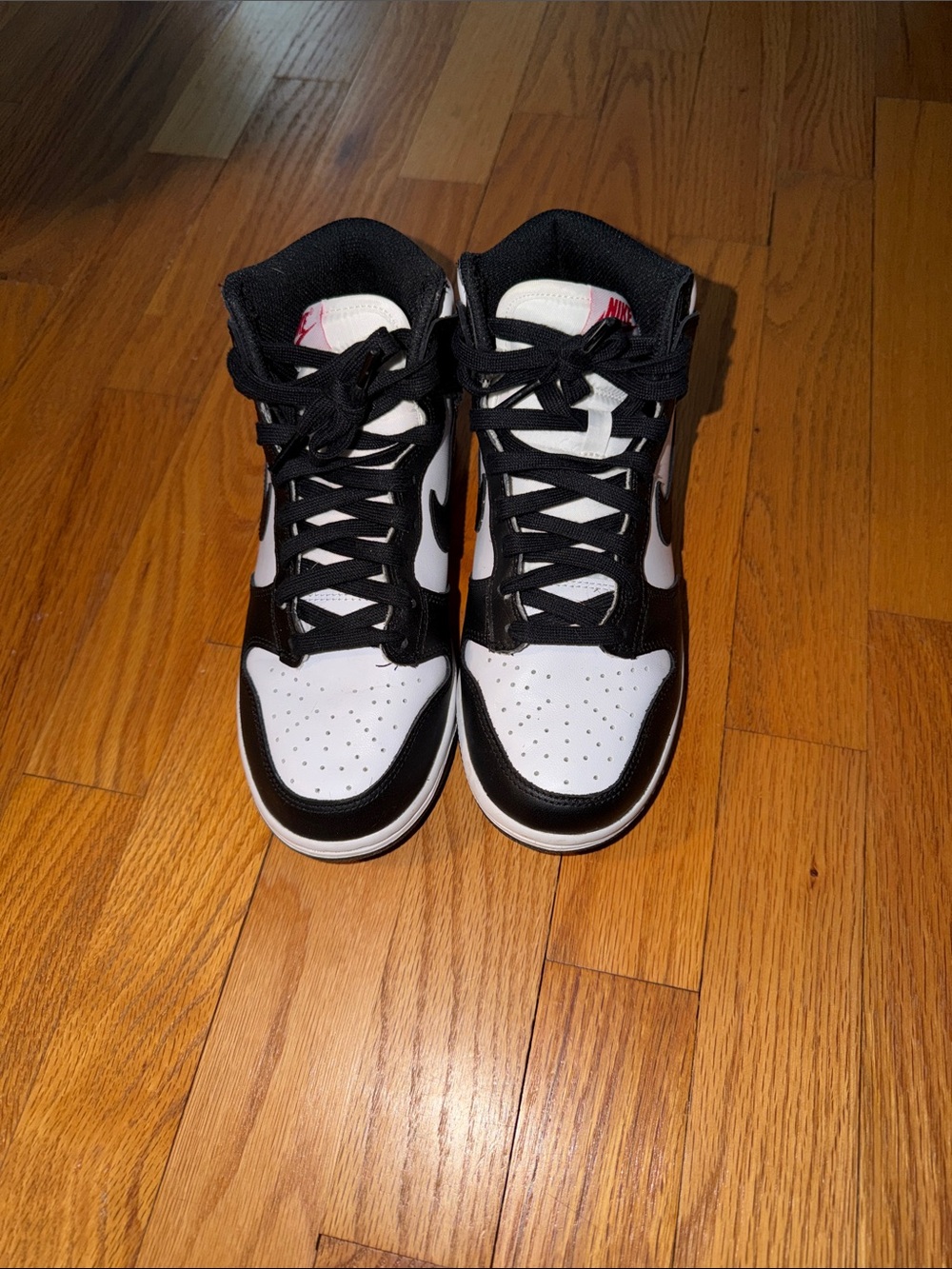 Nike Women’s Black and White High-Top Sneakers with Pink Tongue Logo